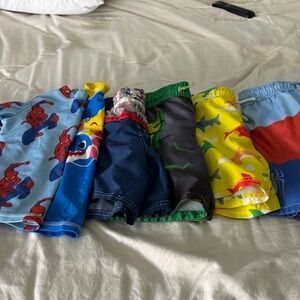 Bundle of toddler boy swim wear! 5 trunks and 2 rash guards. All 4t